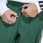 adidas Essentials 3-Stripes Lifestyle Woven Parachute Pants Γυναικείο Παντελόνι Πράσινο